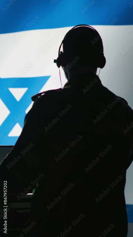 Poster vertical video israeli air defense command operator conscript using radar system on laptop to detect