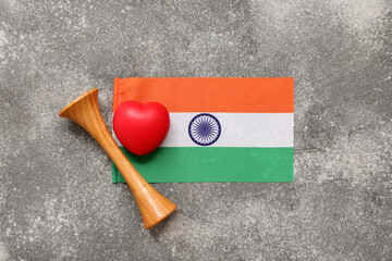 Wooden stethoscope, heart and flag of India on grey grunge background. National Doctor's Day celebration