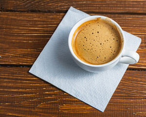 Hand written note on a coffee stained napkin with an empowe