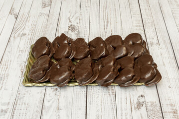 A cake with a layer of melted chocolate on top