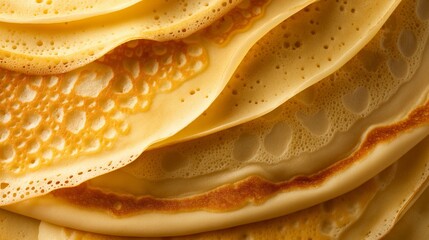 Fototapeta premium Close up of freshly made crepes stacked on top of each other.