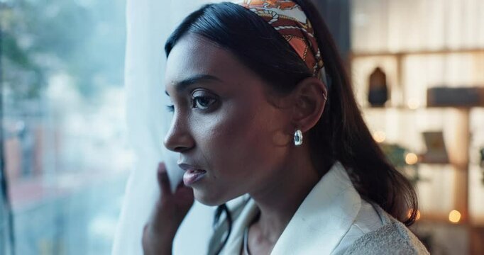 Stress, fear and woman at window with anxiety, scared or panic, phobia or overthinking in house. Psychology, mind or paranoid person with mental health risk, crisis or hiding from stalker at home