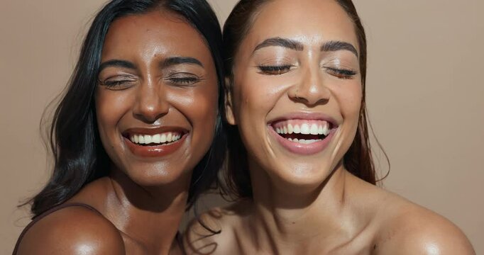 Face, women and laughing for beauty, skincare or wellness with multicultural, inclusion for cosmetics. Female people, healthy skin and happy with eyes closed, glow in dermatology in studio background