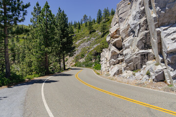 Curvy road around granite mountains in california high sierra 