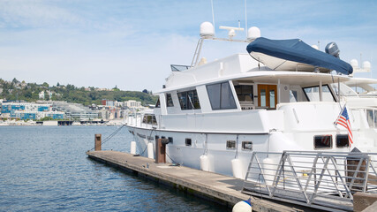 Fototapeta premium boat, yacht, sea, water, boats, luxury, harbor, ship, marina, port, sailing, travel, nautical, ocean, dock, sky, vessel, summer, yachts, sailboat, vacation, pier, sail, harbour, motorboat, seattle, wa