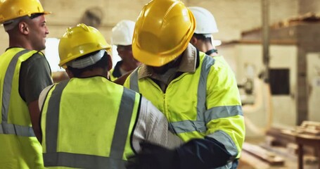 Celebration, construction and handshake with warehouse team in workshop together for project success. Collaboration, hug and well done with carpentry people cheering in factory for manufacturing