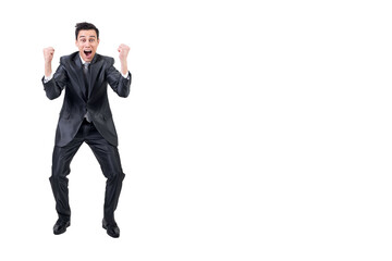 Excited man celebrating victory in studio. White background.