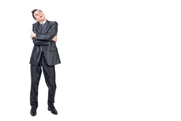 Smiling man in suit embracing himself. White background.