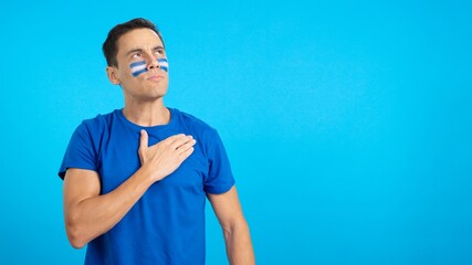 Man listening to the El Salvador national anthem with solemnity