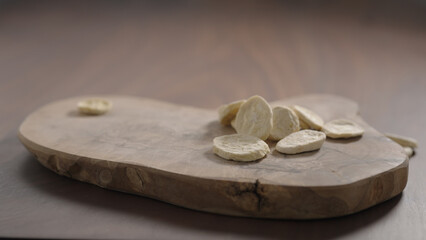 freeze dried banana chips on olive board