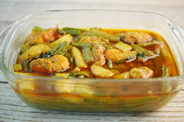 king prawn fish curry in a bowl on table 