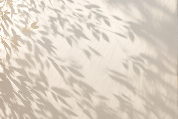 Obraz premium Beautiful texture of beige brown luxury, smooth stucco wall with soft foliage dappled light of tropical tree leaf shadow 