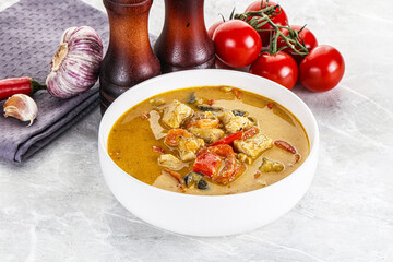 Traditional yellow Thai curry with chicken