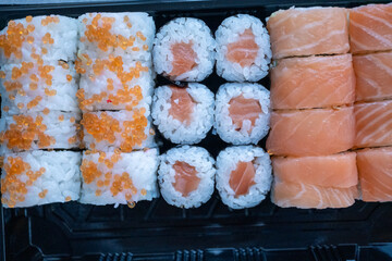 salmon sushi served in plastic