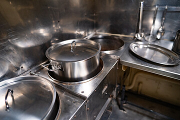 polished pots in the galley of a decommissioned submarine