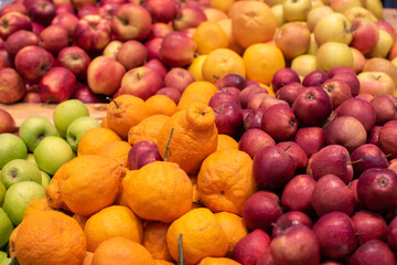 Various type of fresh fruits arrange in grocery store. Apples, oranges, tangerines.