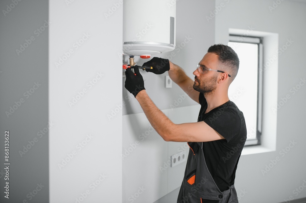 Poster professional plumber checking a boiler and pipes, boiler service concept