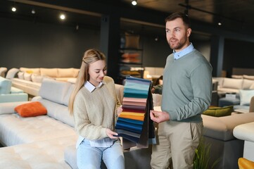 Married couple in the shop choosing furniture