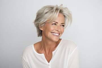 Portrait of a beautiful middle aged woman smiling at the camera.
