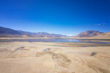 the lake, sand dune, with Brahmaputra Yarlung Zangbu River and Mt. everest and Lhotse