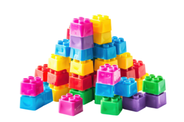 Colorful plastic toy building blocks stacked in a creative pyramid on a white background. Ideal for kids, play, and educational concepts.