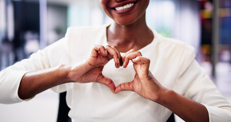 Senior African American woman making heart sign with hands