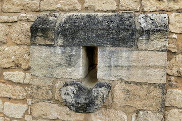 Weep hole found in the wall of Chateau de Beynac in the Dordogne, France. These allow for drainage...