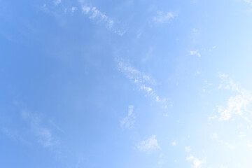 beautiful blue sky and white fluffy group of clouds with sunrise in the morning, natural background