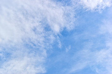 beautiful blue sky and white fluffy group of clouds with sunrise in the morning, natural background