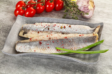Marinated herring fillet with green onion