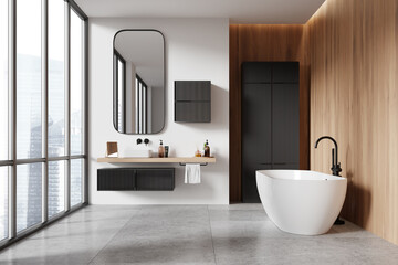 Minimalist home bathroom interior with sink, bathtub and dresser with window