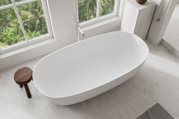 Top view of modern bathroom interior with bathtub and panoramic window