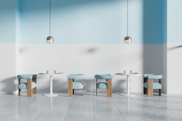 Modern cafe interior with blue chairs and white tables, minimalistic design, light background,...