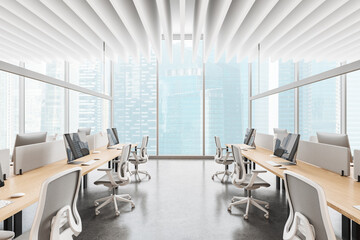 Cozy coworking interior with pc desktop in row, panoramic window