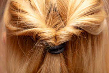 Naklejka premium Braids on a woman's head. Close-up
