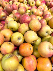 Red ripe apples on the Market showcase. Background