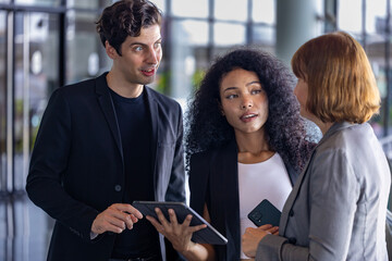 Team of diversity business people are discussing over the new strategic strategy projects on investment real estate while walking around the office building for new project and planning