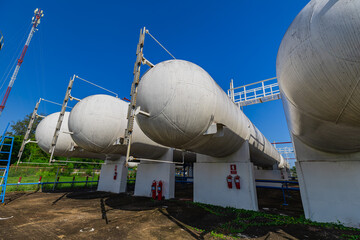 Storage tank of gas LPG in the horizontal white tank's