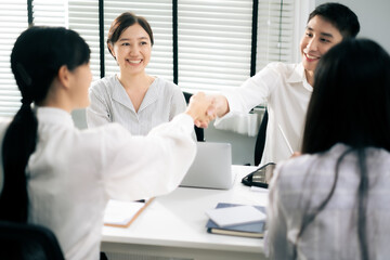 Asian Man and woman co-worker consult about work or team meeting at work with serious emotion.