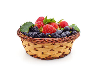 Berries of currants with mulberries and strawberries in the basket.