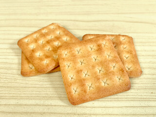 crackers biscuits with sugar on wooden table background, high angle view