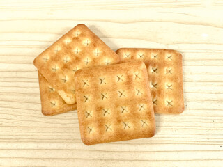 crackers biscuits with sugar on wooden table background, top view, flat lay