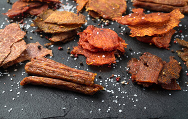 Mix of dried meat Jerky . From chicken , beef and pork.