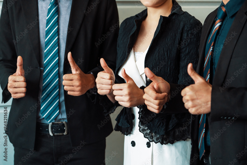 Wall mural many happy business people make thumbs up sign join hands together with joy and success. company emp