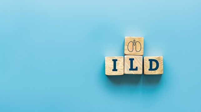 Wooden blocks with the abbreviation ILD (Interstitial Lung Disease) on a blue background.