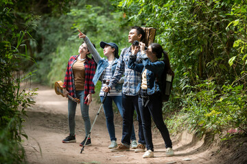 Tourism asian woman travel with backpack adventure holding map to find directions and walking relax...