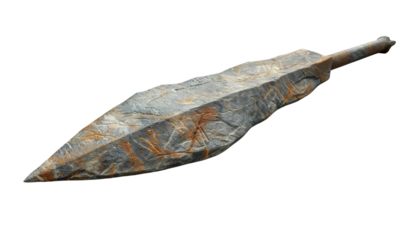 An ancient stone spearhead with detailed carvings, showcasing historical craftsmanship and archaeological significance.
