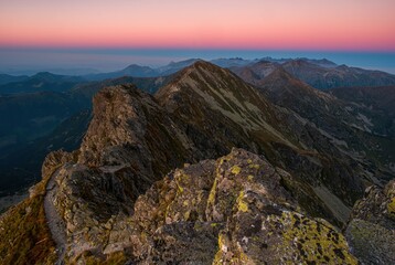 Beautiful colorful sunset on top of the hill. Hiking in Slovakia mountains Banikov and Ziarska valley, Western Tatras Slovakia. Beautiful mountain places of Europe