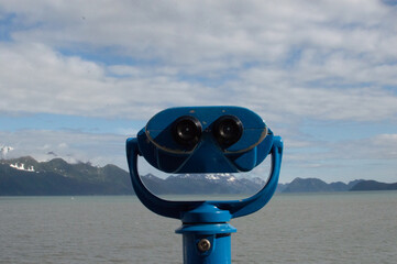 Coin Operated Binocular Overlooking Water and Mountains