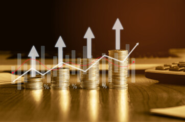 Upward golden money coin stack on office desk with Up arrow, chart and graph. Finance concept background. 